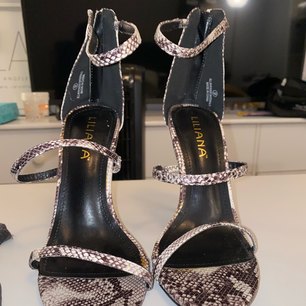 Black and white strappy heels